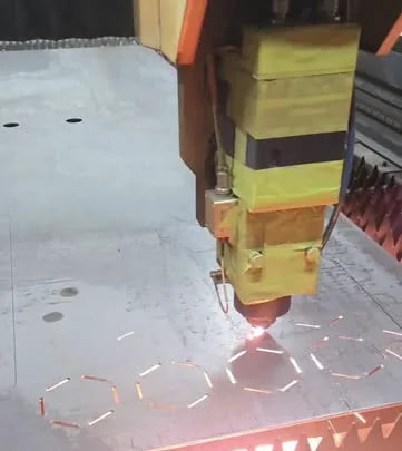Fiber laser head cutting a steel sheet in the OptiKutz shop, Niagara Falls