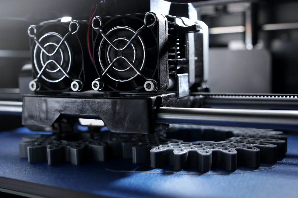 3D printer printing a set of gears